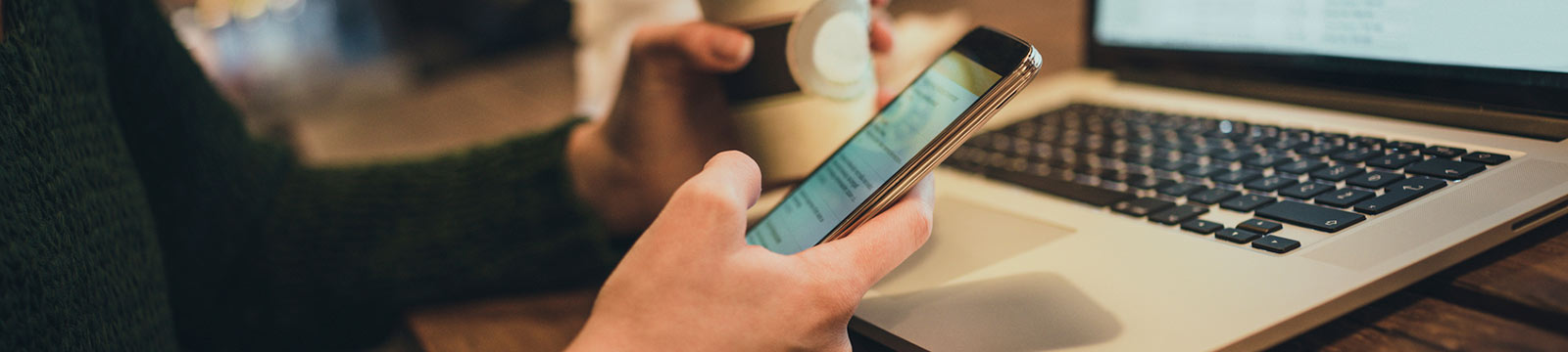 Close up of a person's hands holding a smartphone